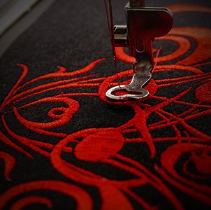 Vibrant red embroidery because we support this industry