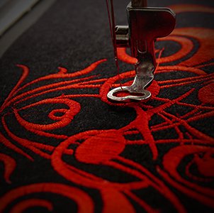 Vibrant red embroidery because we support this industry