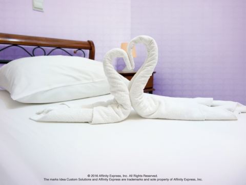 A View of a Hotel Bed and Towels with a New Take on the Hospitality Sector for Business