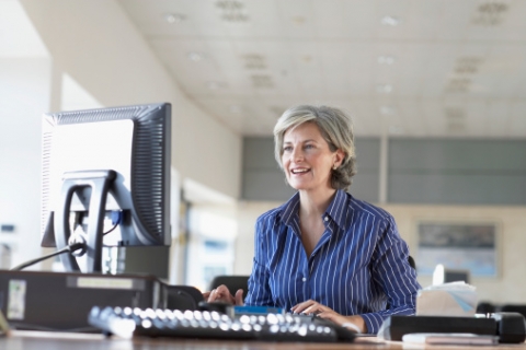 Woman Working in Her Office Implementing New Habits and Routines